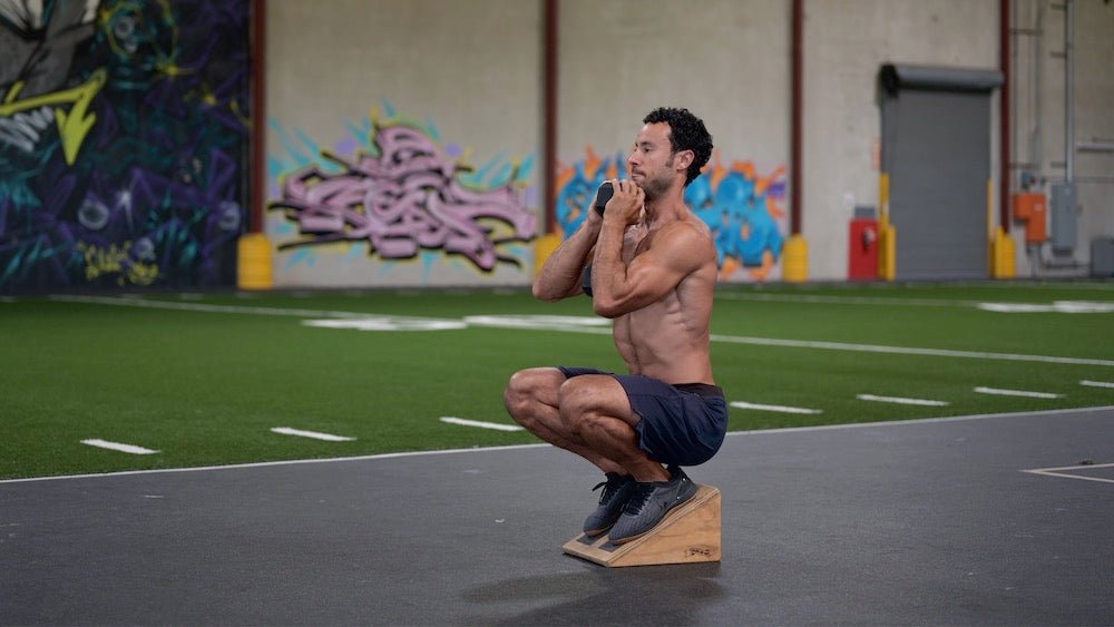 Heels Elevated Goblet Squat – Benefits, Mistakes, Variations & Step-By-Step Guide - Gripzilla - The Best Grip and Forearm Strength Exercises, Arm Wrestling Tools, Hand Grippers to Improve Grip Strength